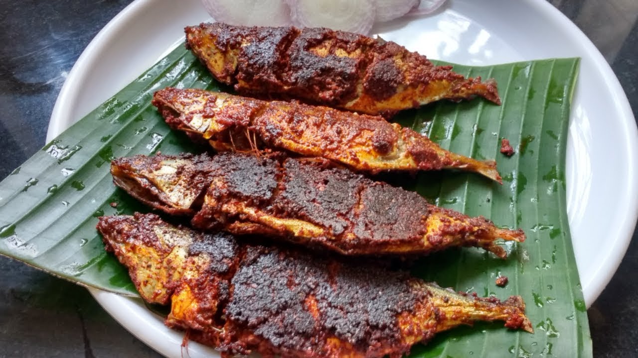Bangude (mackerel) coated in red coastal masala, fried and served on a banana leaf, a signature Kundapura seafood dish