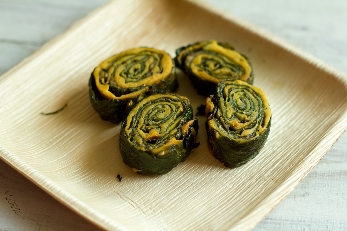 Pathrode, colocasia leaves layered with spiced rice batter, rolled, steamed and sliced