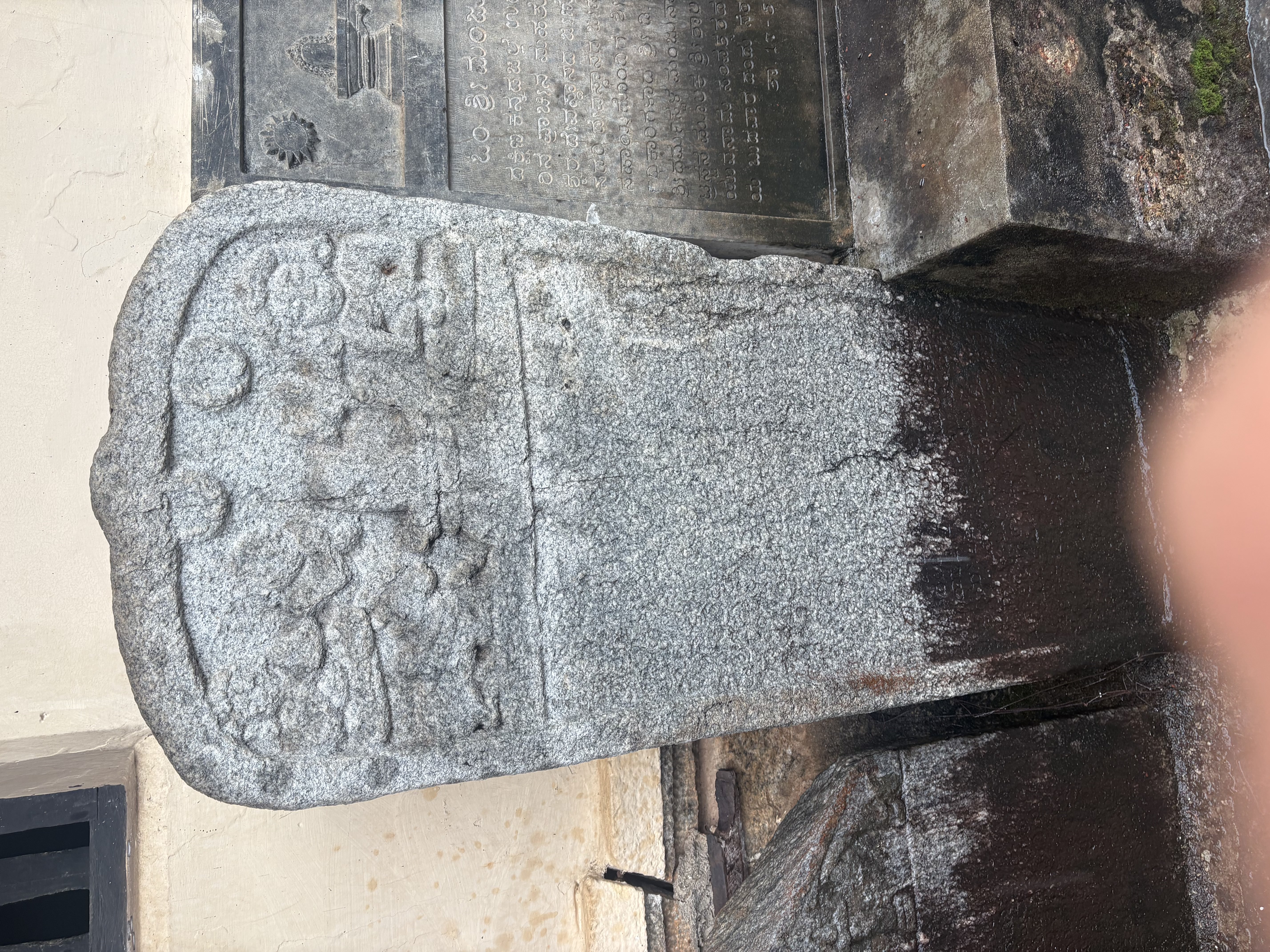A granite plaque with linga, Nandi, sun and moon