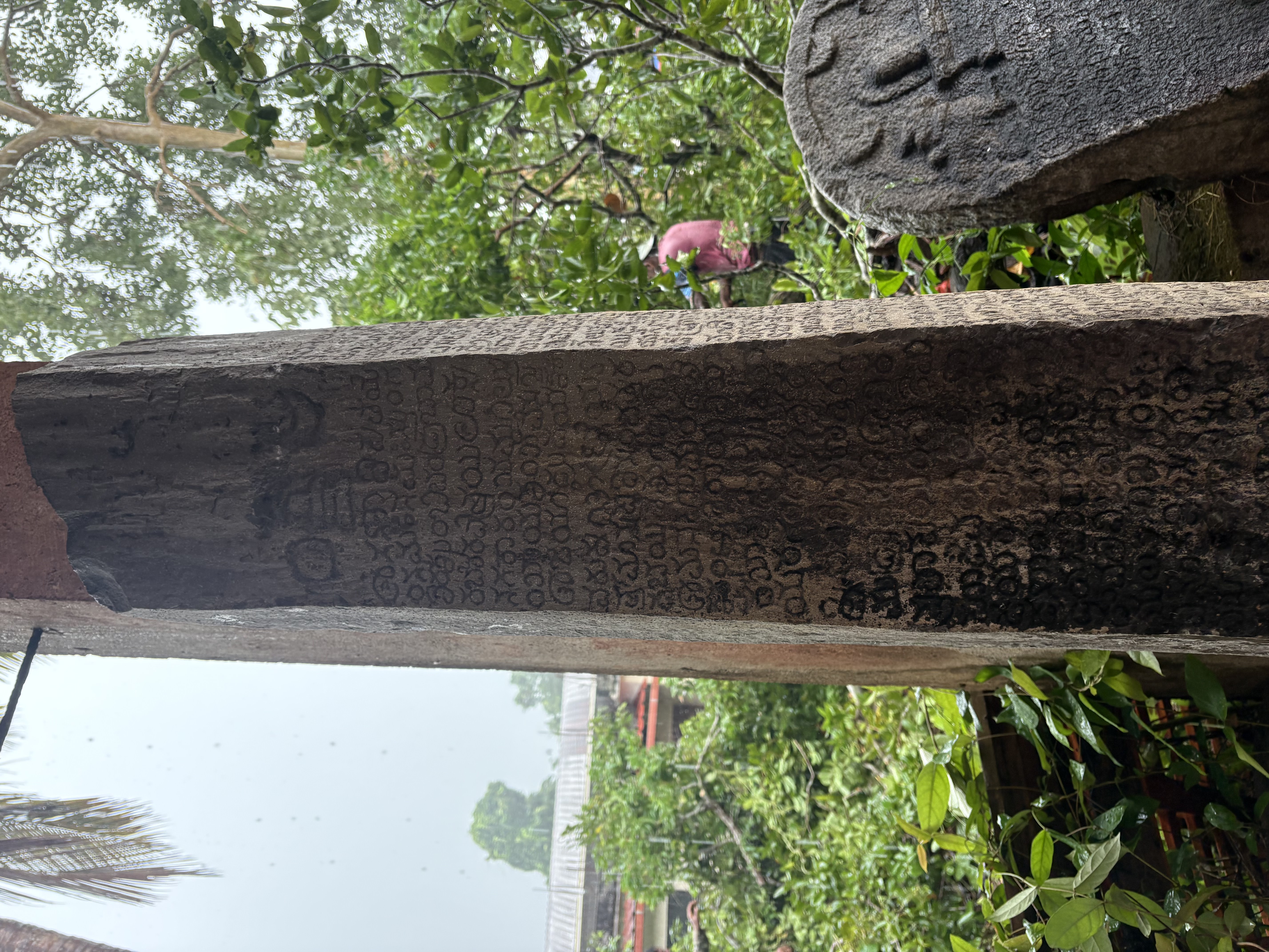 A tall inscribed pillar in old Kannada