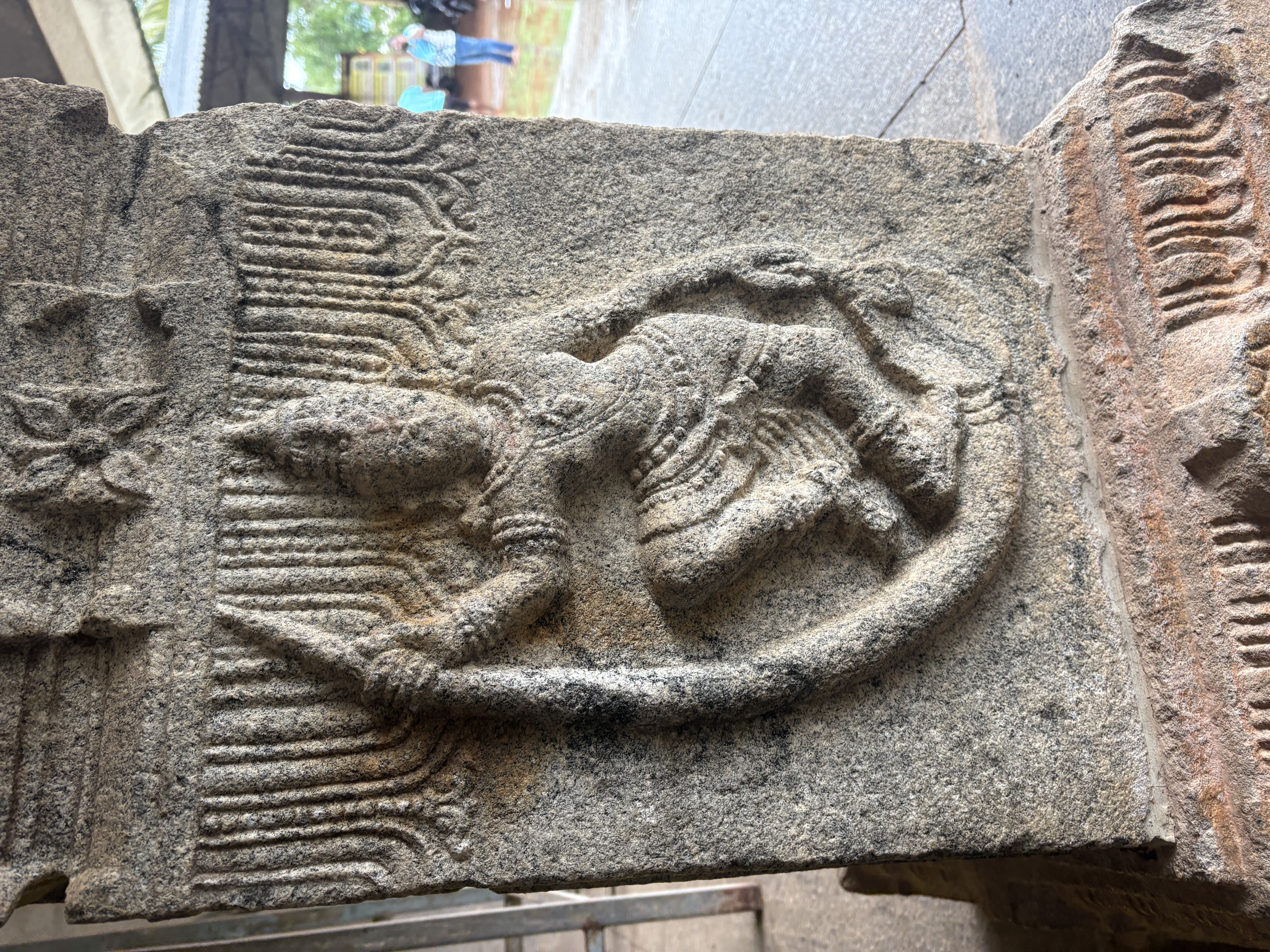 Carved dancing figure on a temple pillar